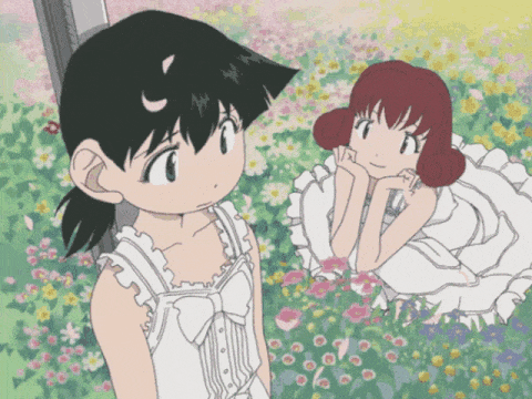 animted gif of two girls in a flower field